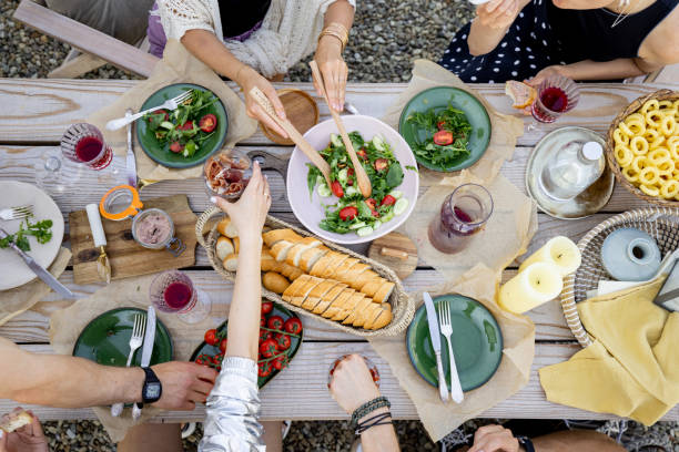 istock Dining table with food outdooors 1327328180