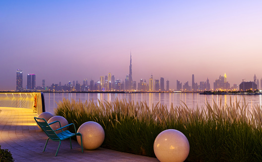 Dubai, United Arab Emirates - June 23, 2021: Dubai city skyline in the evening. A view from Dubai creek harbour district.