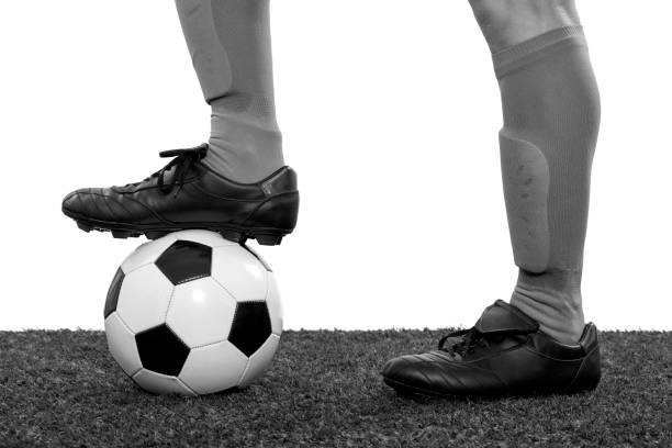 istock Young soccer player on grass on white background. 1327328847