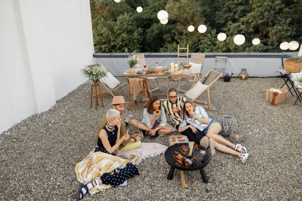 istock Rooftop terrace with friends having a picnic 1327329539