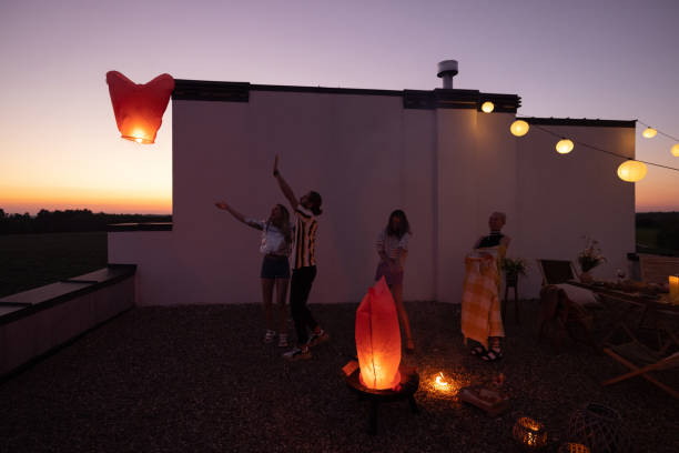 istock People launch sky lanterns on the roof 1327329867
