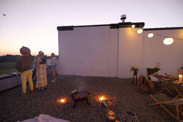 istock Friends have a roooftop party at night 1327329898