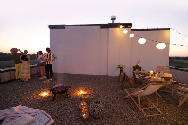 istock Friends have a roooftop party at night 1327329913