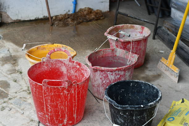 istock Five used builders bucket some filled with water 1327333180