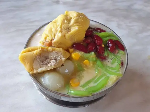 The delicious Musang king durian cendol recipe, the popular iced sweet coconut milk dessert of durian favor, in Malacca, Malaysia