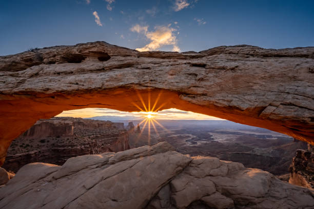 istock Sunburst Breaking The Horizon Framed By Mesa Arch in Canyonlands 1327337088
