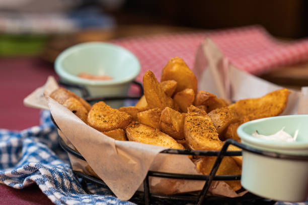 istock Baked potatoes in a basket with sauce 1327339724