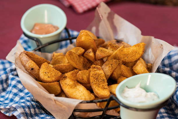 istock Baked potatoes in a basket with sauce 1327339739