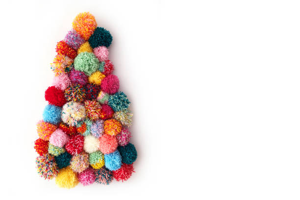 istock Christmas tree made of multi-colored pompons on a white background. 1327340724