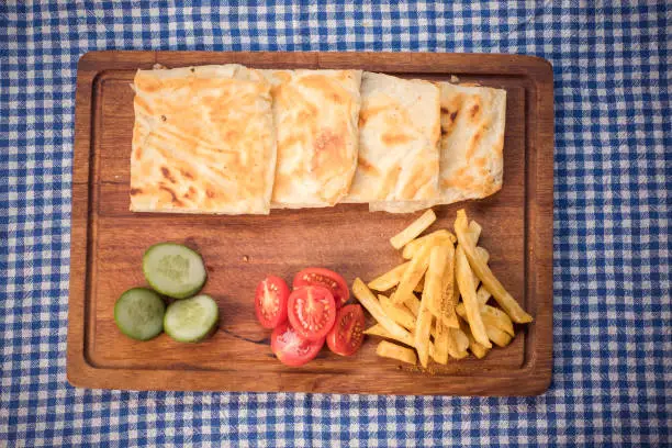 Photo of Turkish Traditional Gozleme on wooden plate