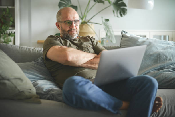 istock mature adult man working from home office ( laptop, negative emotion ) 1327342986