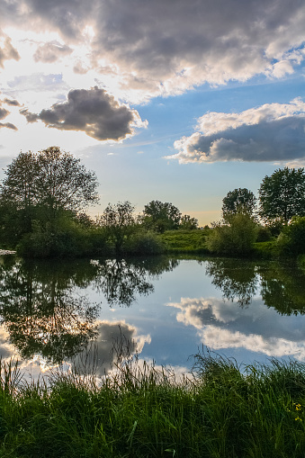 Clouds reflecting on water in Den Bosch