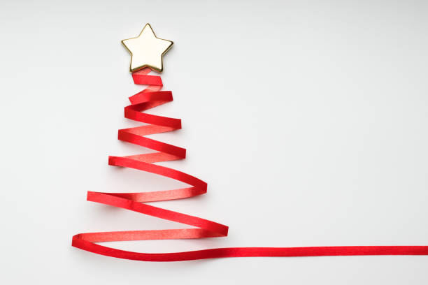 istock Christmas tree with golden star from red ribbon 1327344227