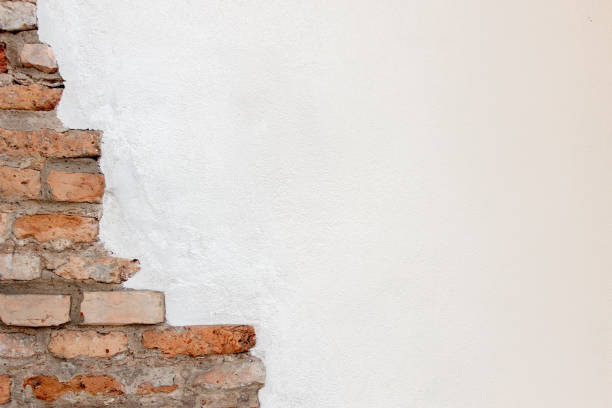 istock White plaster with old vintage red brick wall banner background 1327345107