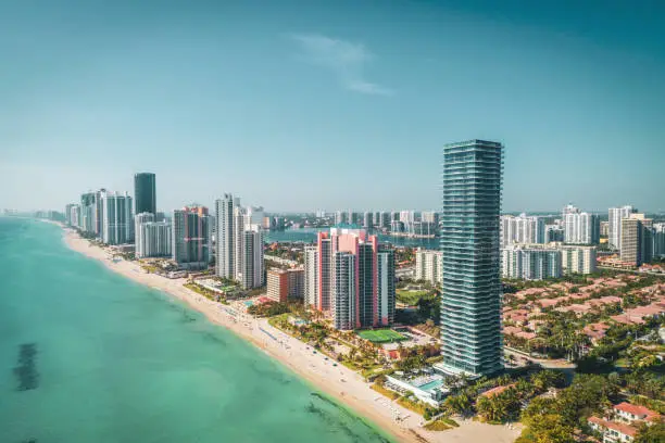 Aerial view of the Sunny Isles, FL ocean skyline. Take a look at all the buildings in the Sunny Isles area including buildings like the Regalia, Porsche Tower and Jade Signature.