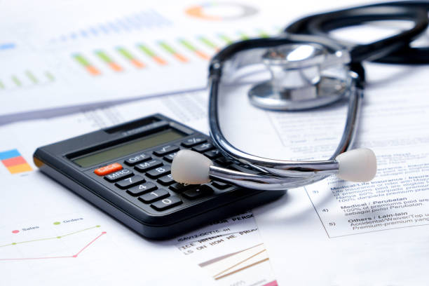 istock Stethoscope with Pen, Charts, Graphs, Finance, Account, Statistics, Investment, Analytic Research Data, Medical and Insurances Concept 1327345160