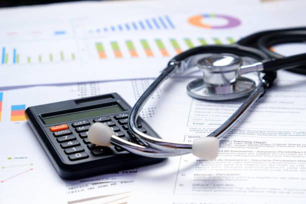 istock Stethoscope with Pen, Charts, Graphs, Finance, Account, Statistics, Investment, Analytic Research Data, Medical and Insurances Concept 1327345163