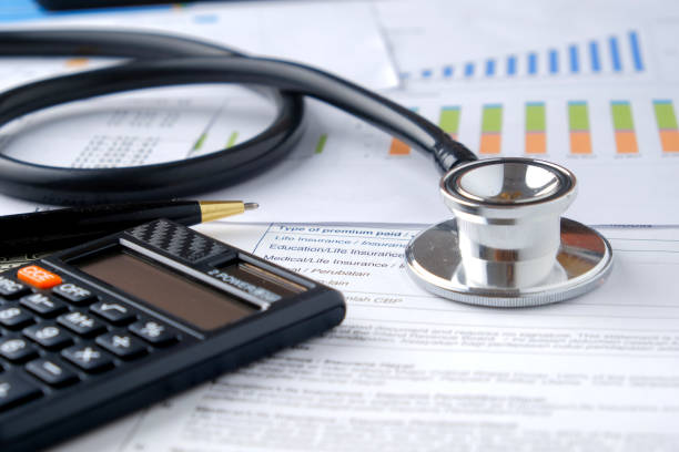 istock Stethoscope with Pen, Charts and Graphs, Finance, Account, Statistics, Investment, Analytic Research Data, Medical and Insurances Concept 1327345196
