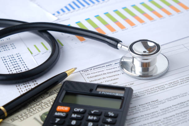 istock Stethoscope with Pen, Charts, Graphs, Finance, Account, Statistics, Investment, Analytic Research Data, Medical and Insurances Concept 1327345205