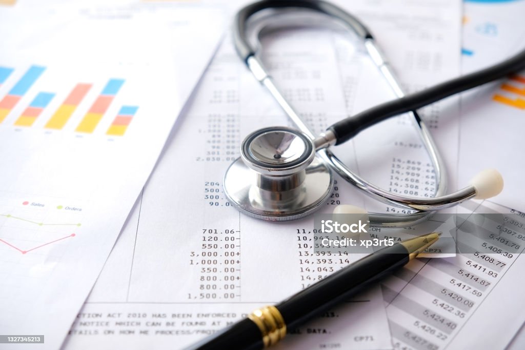 Stethoscope with Pen, Charts and Graphs, Finance, Account, Statistics, Investment, Analytic Research Data Economy Spreadsheet and Business Company Concept Healthcare And Medicine Stock Photo