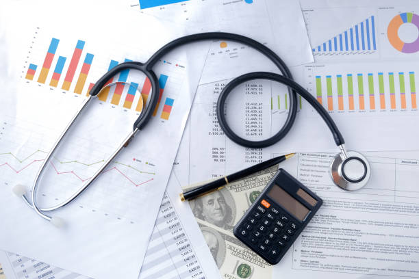 istock Stethoscope with Pen, Charts and Graphs, Finance, Account, Statistics, Investment, Analytic Research Data, Medical and Insurances Concept 1327345215