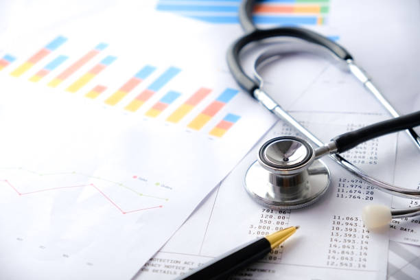 istock Stethoscope with Pen, Charts and Graphs, Finance, Account, Statistics, Investment, Analytic Research Data Economy Spreadsheet and Business Company Concept 1327345216