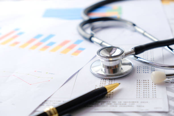 istock Stethoscope with Pen, Charts and Graphs, Finance, Account, Statistics, Investment, Analytic Research Data Economy Spreadsheet and Business Company Concept 1327345218