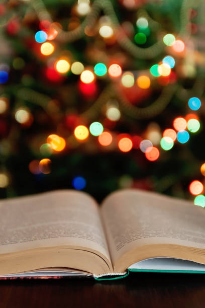 istock Christmas and bible with blurred candles light background 1327348042
