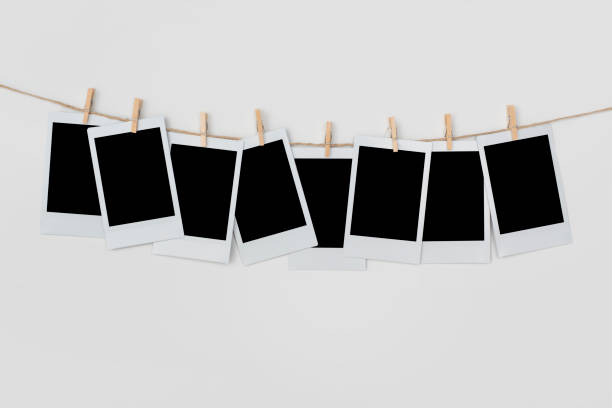 istock Blank polaroid pictures hanging on a clothes line 1327348970