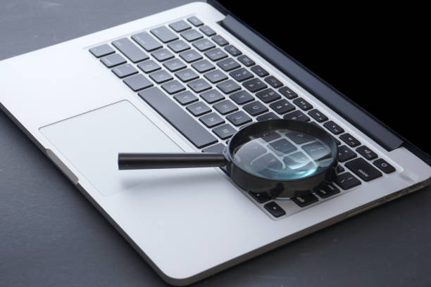 istock Laptop computer with magnifying glass, concept of search 1327352799