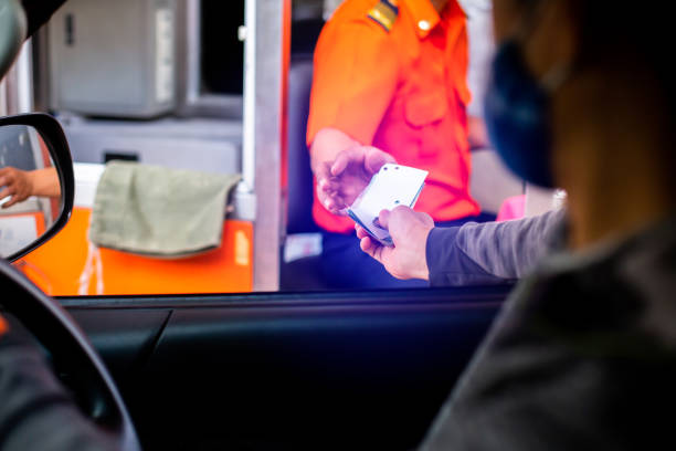 istock Selective focus to hand of driver pay for the expressway. 1327356115