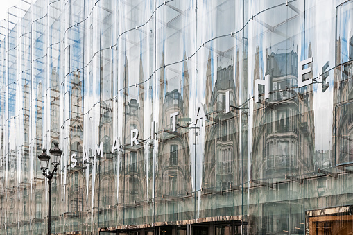 Glass Office building facade with Distorted reflections, central Berlin, Germany