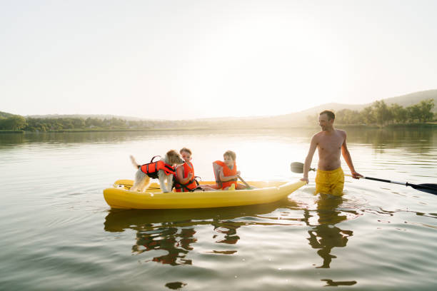 istock Father and sons kayaking on the lake 1327358656