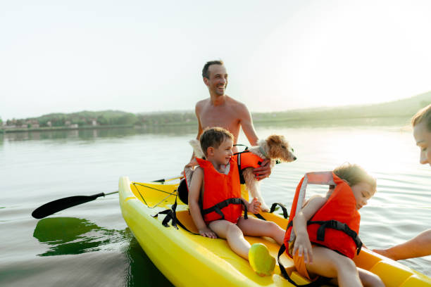 istock Family kayaking on the lake 1327358668