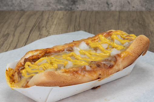 Loaded chile cheese hot dog smothered in cheese, chile, and onions.