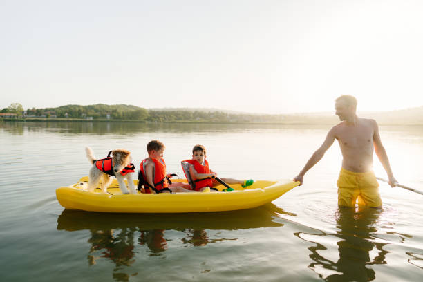 istock Father and sons kayaking on the lake 1327358750
