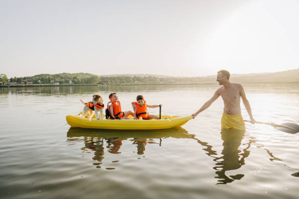 istock Father and sons kayaking on the lake 1327358751