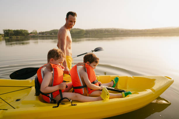 istock Father and sons kayaking on the lake 1327358805