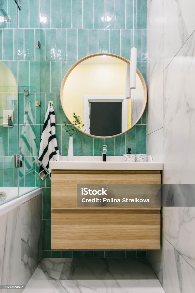 Stylish modern luxurious marble and green tiles bathroom with washbasin Bathroom Stock Photo