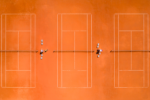 Three tennis courts viewed from directly above.