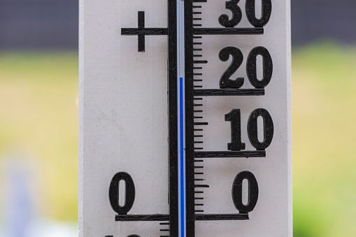 Close up view of thermometer showing 22 degrees.