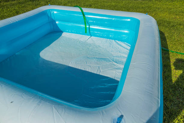 istock Close up view of filling play pool with water processing. Sweden. 1327363076
