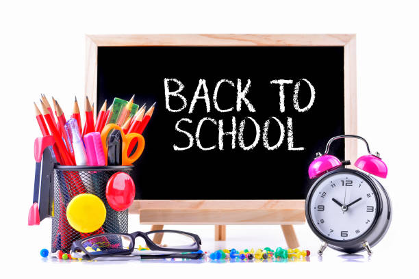 istock School supplies on chalkboard with text Back to School 1327364130