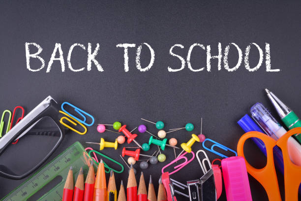 istock School supplies on chalkboard with text Back to School 1327364139