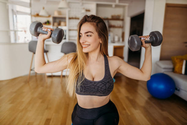 istock Young woman exercising 1327365156