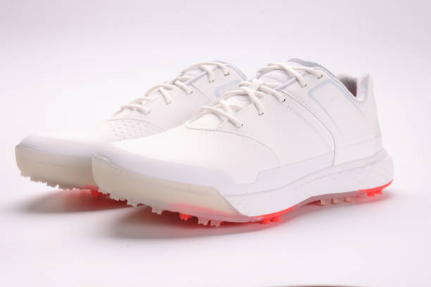White leather boots with spikes on sole closeup