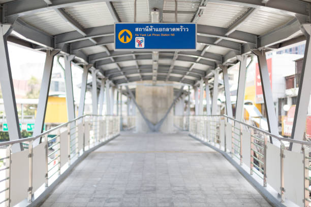 Selective focus of Thai meaning on the sign is "Ha Yaek Lat Phrao Station" at the BTS station Bangkok Thailand , July 1 , 2021 : Selective focus of Thai meaning on the sign is "Ha Yaek Lat Phrao Station" at the BTS station bts skytrain stock pictures, royalty-free photos & images