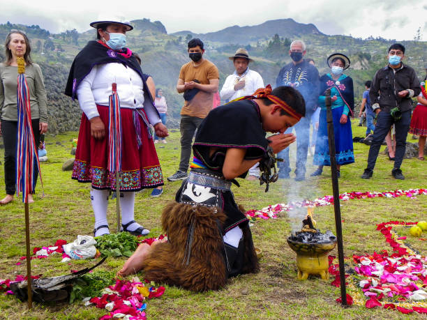 Spiritual ritual of andean people called Chacana Chobshi, Azuay province, Ecuador - June 21,2021: Celebration Inti Raymi at Chobshi archeological site of ancient ruins of Cacique Duma Сastle. Spiritual indigenous ceremony Chacana around Andean cross inti raymi stock pictures, royalty-free photos & images