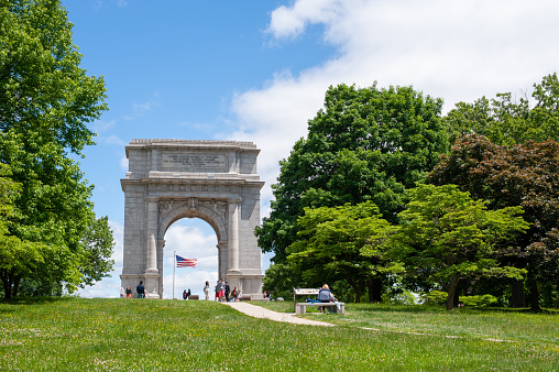 King of Prussia, USA - May 31, 2021. People enjoying their time around National Memorial Arch at Valley Forge National Historic Park, Pennsylvania, USA