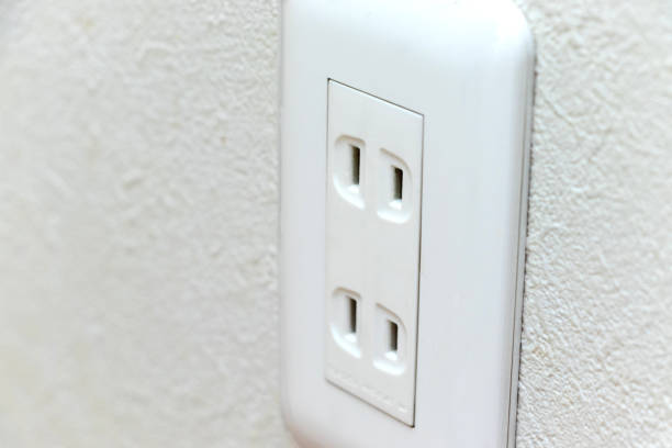 istock Close up on the electric outlet mounted on the wall 1327381290